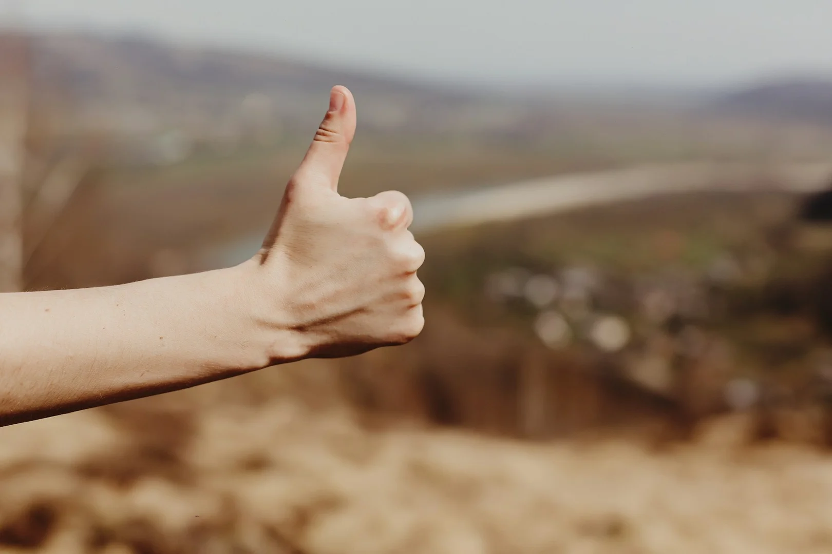 Thumbs-up gesture symbolizing choosing the right online fundraising platform for schools.