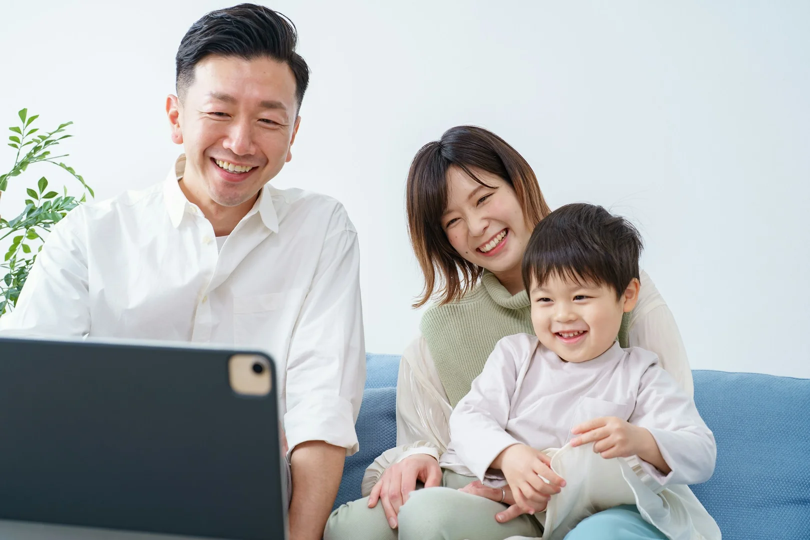 Family reviewing school lunch orders together using a laptop.