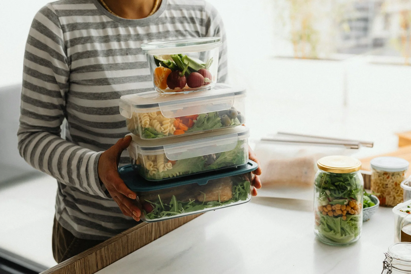 Vegetarian meal containers prepared to encourage healthy eating habits in children.