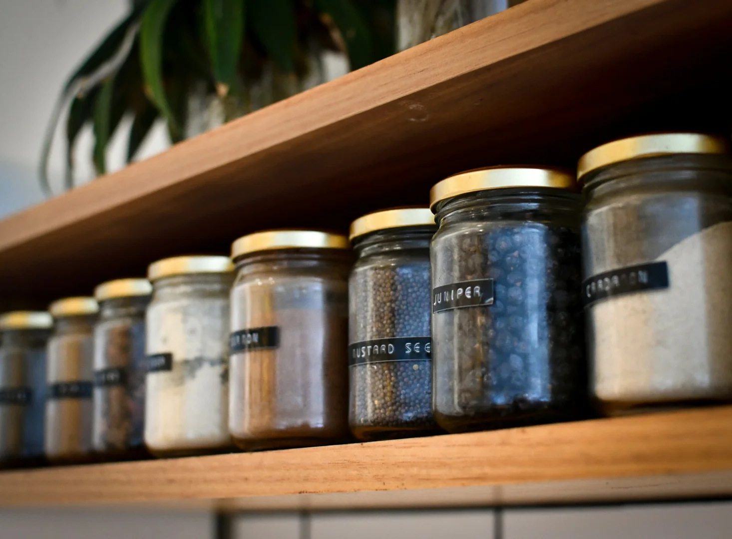 Labeled jars in a pantry showing organized ingredients for allergy-safe meal preparation.