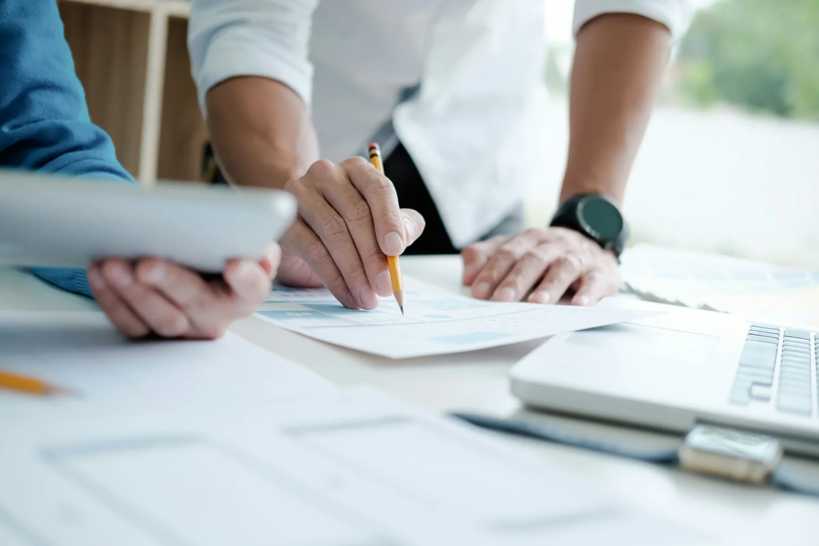 Parent council members reviewing lunch program plans during a meeting.
