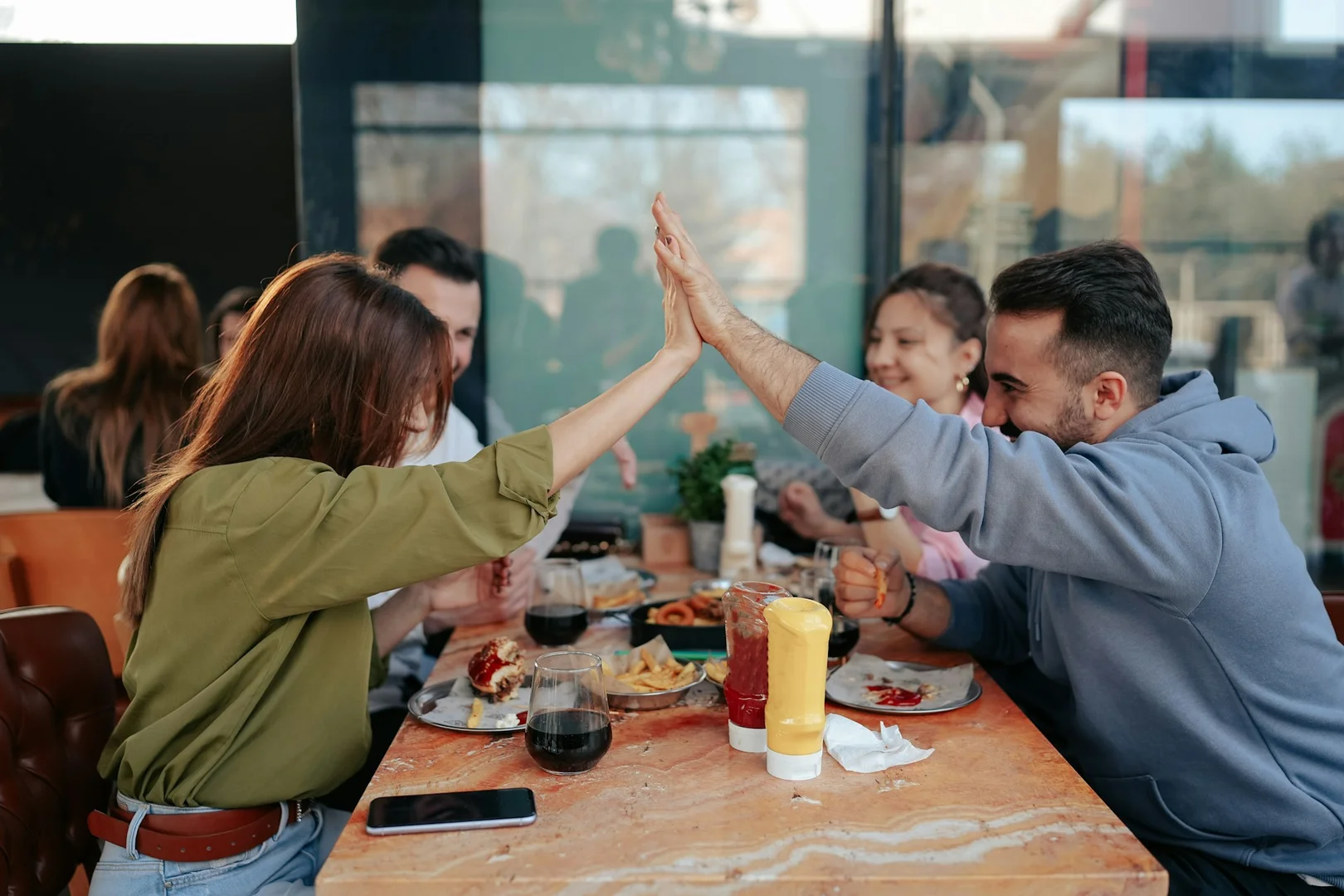 Community members celebrating a successful school lunch program partnership.