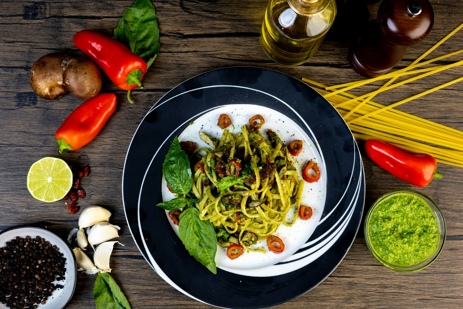 Vegetarian pasta with pesto, peppers, and herbs, a kid-friendly hot lunch option for schools.