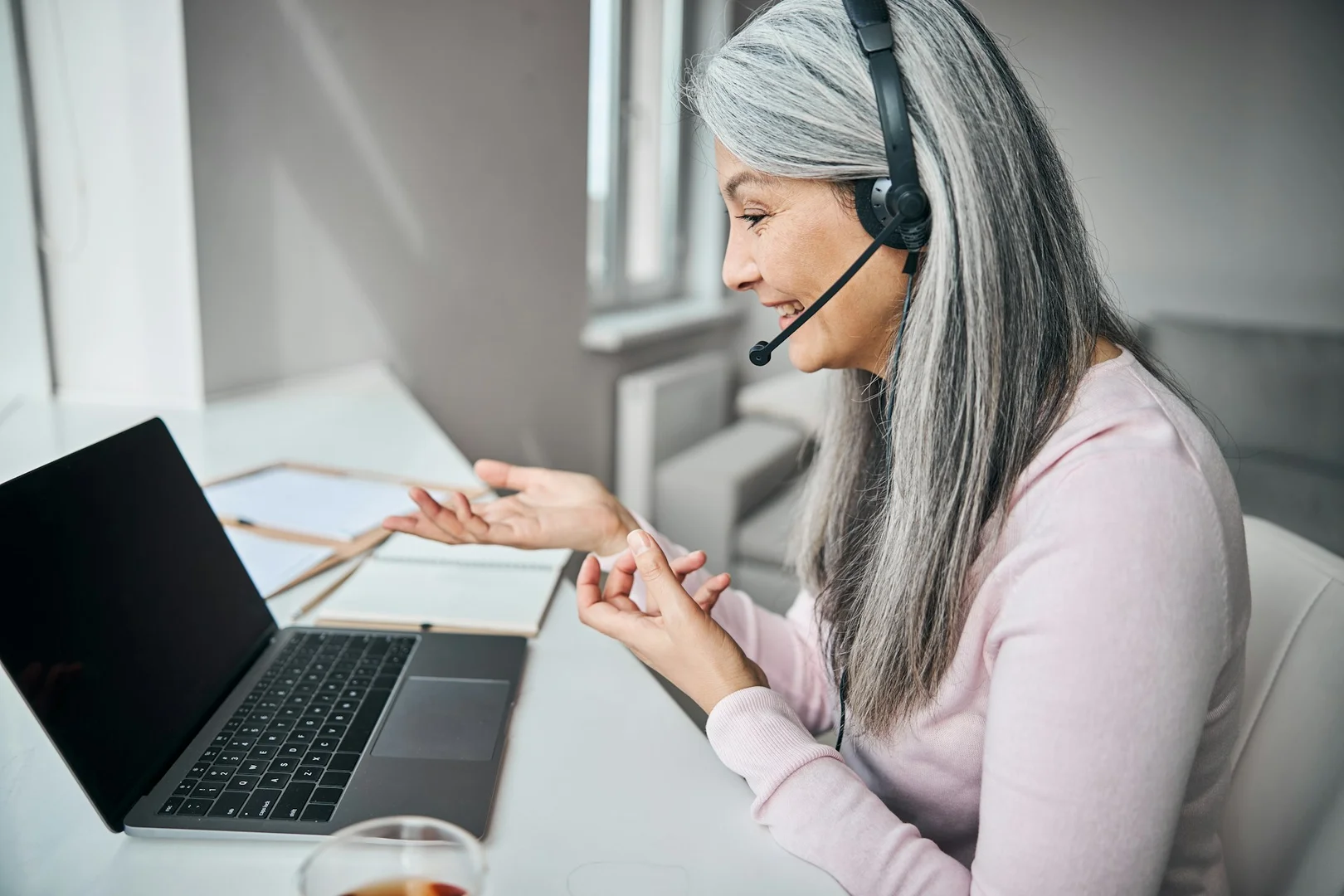School council member on a virtual call improving communication with parents and vendors.