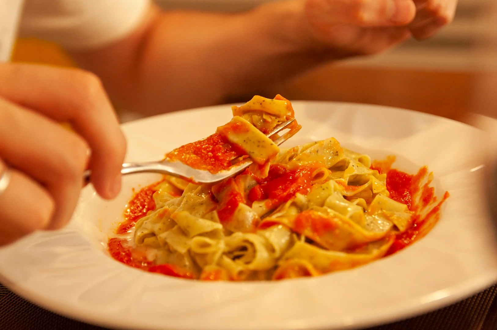 Kid-friendly nut-free pasta with tomato sauce served as a hot lunch option for schools.