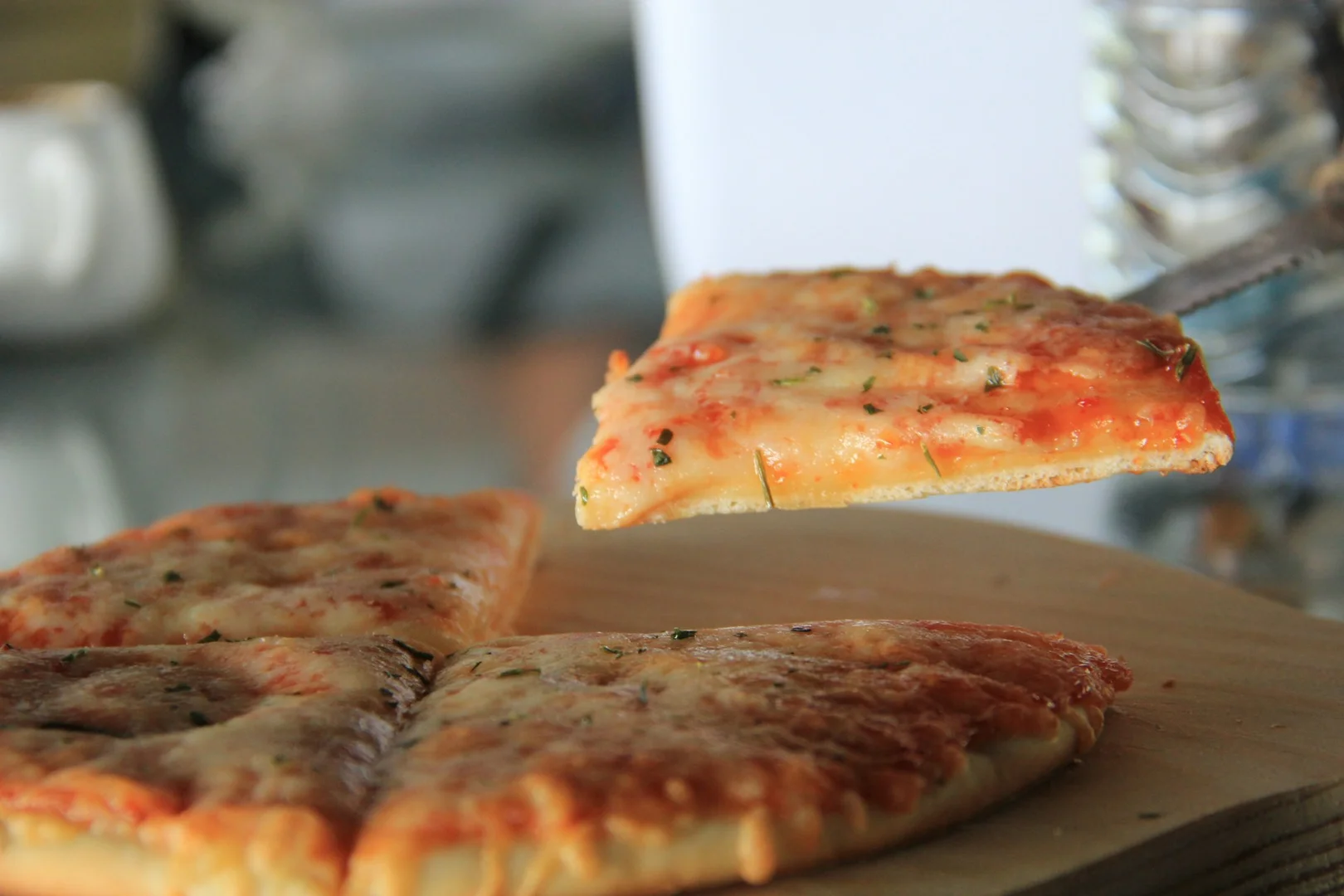 Slice of pizza as an example of a naturally nut-free meal option for school lunch programs.