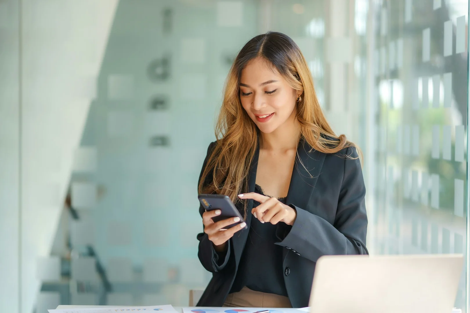 Parent checking a reminder on a smartphone.