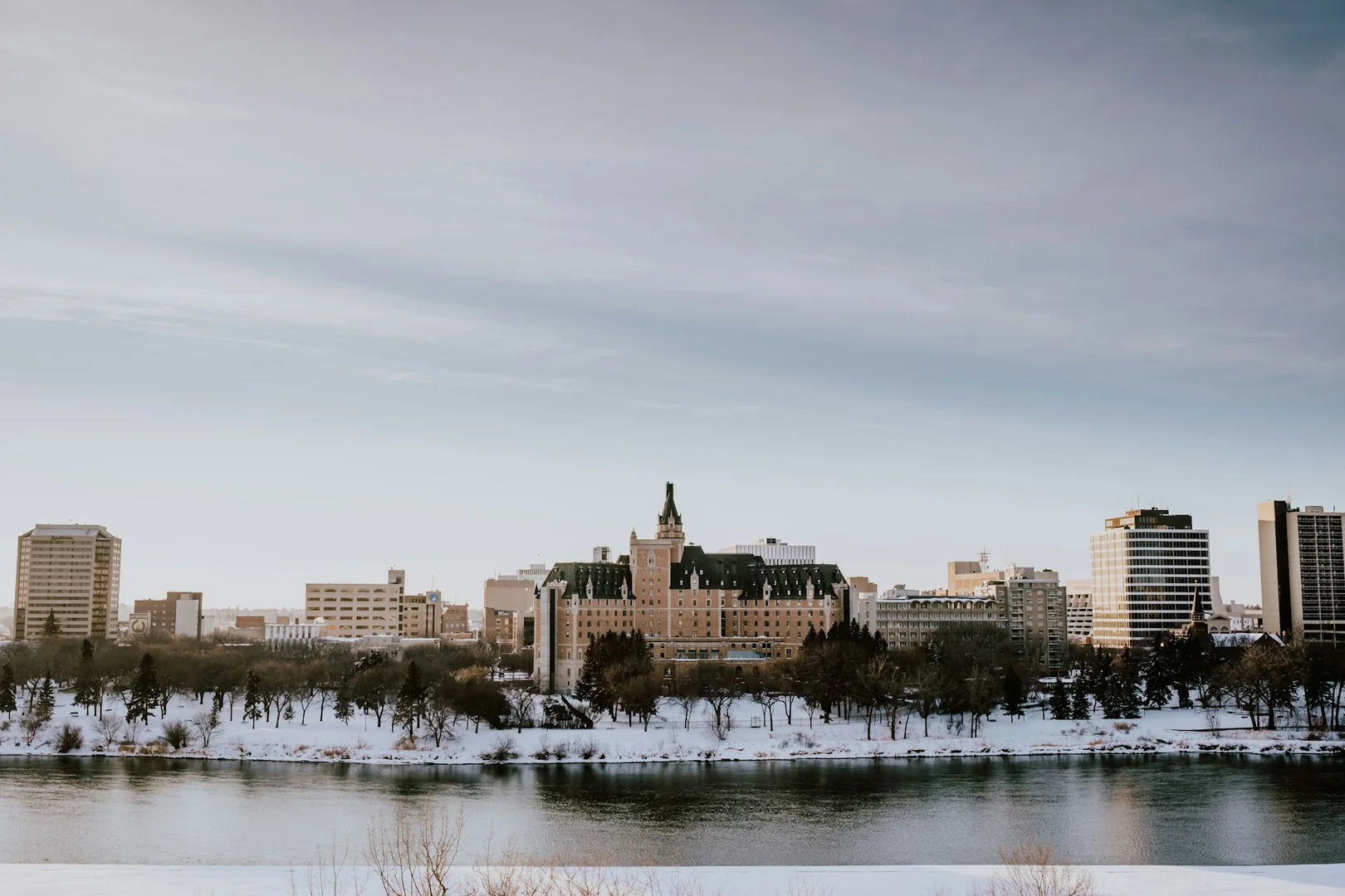 Winter skyline of Saskatoon along the river, representing local school community growth and lunch program expansion.