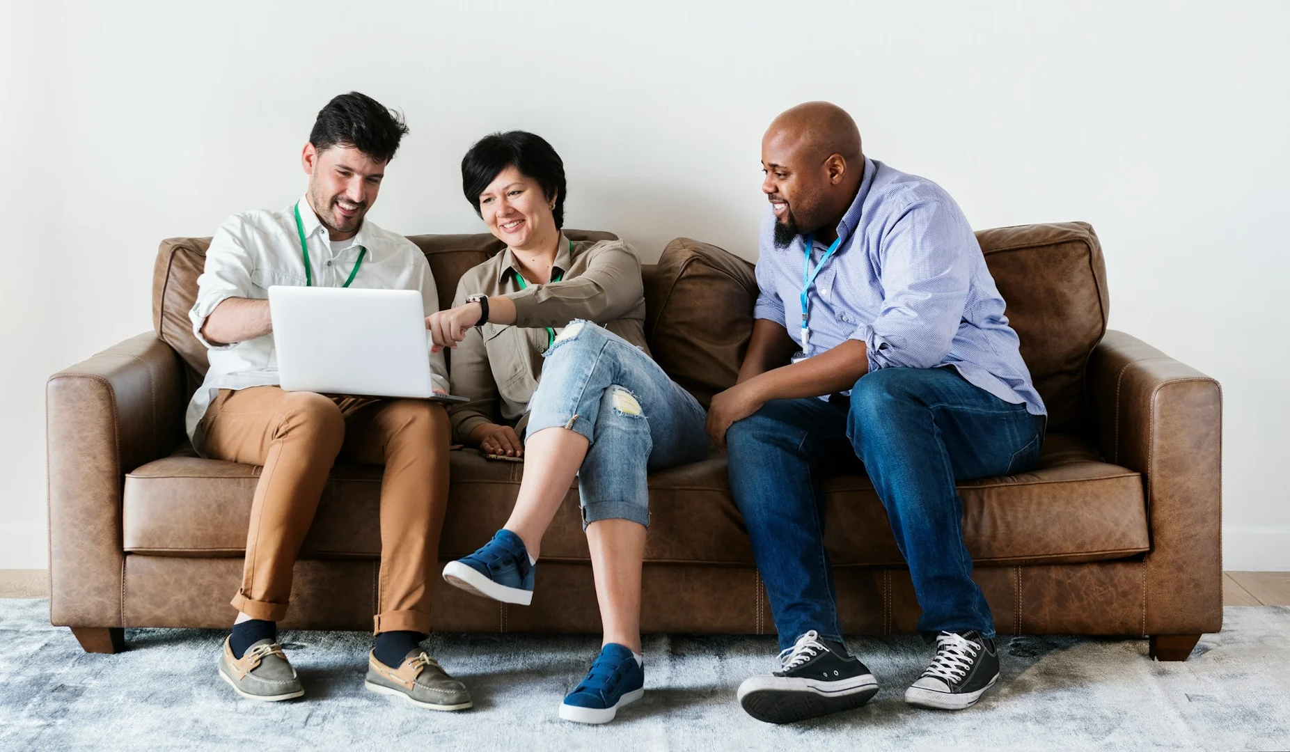 School staff and council members using a laptop to improve communication in lunch programs.