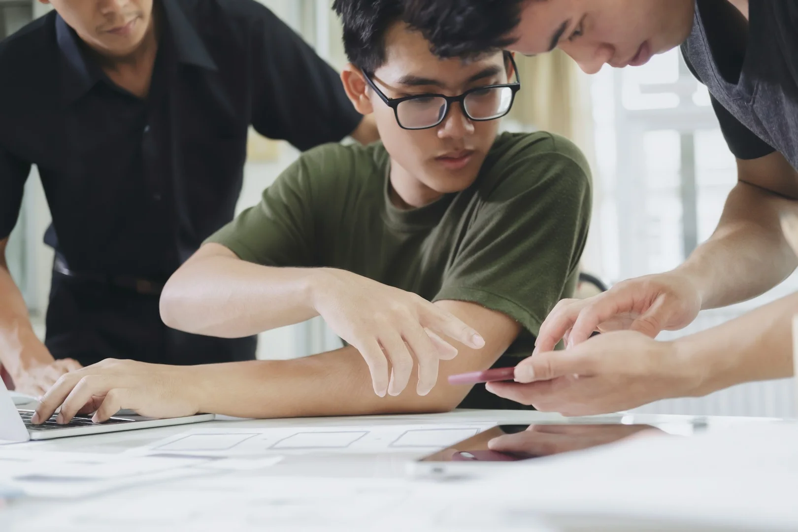 Teachers and school staff collaborating on digital tools to improve lunch program management.
