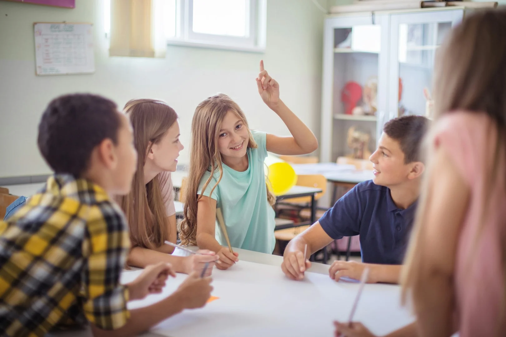 Students talking together during a school lunch activity.